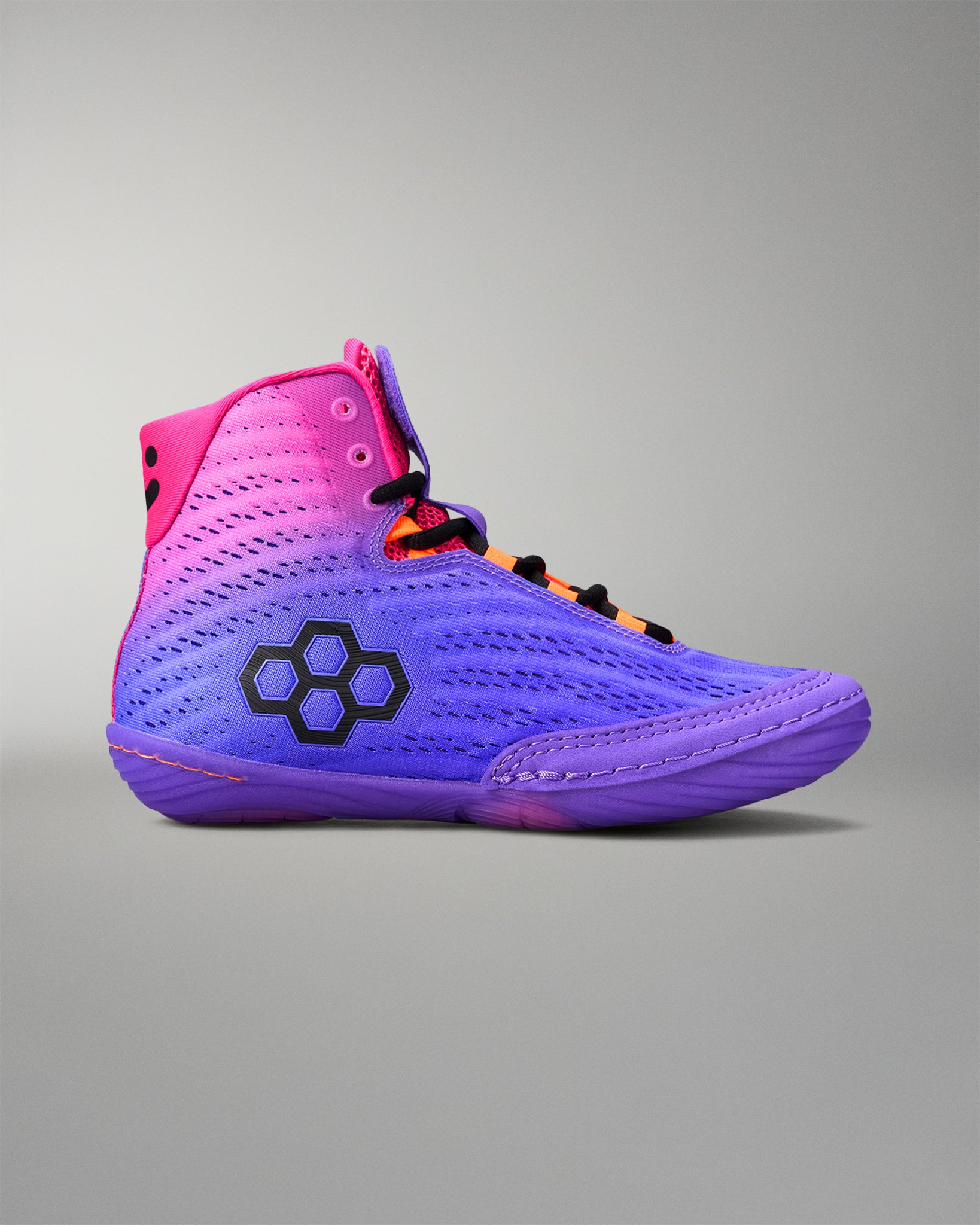 Purple and pink wrestling shoe with a black logo on a gray background