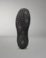Black Wrestling shoe sole with textured pattern on a gray background