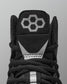 Black Wrestling shoe with a geometric logo on a gray background
