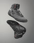 Gray wrestling shoes with black accents on a gray background