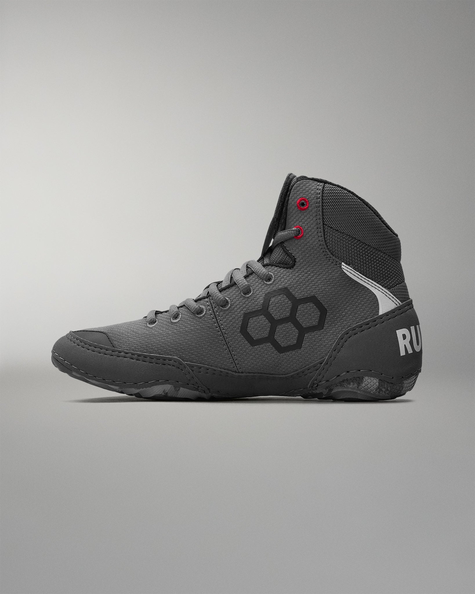 Gray wrestling shoe with a 'RUDIS' brand logo on a gray background