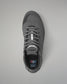 Gray wrestling shoe with a visible brand logo on a gray background