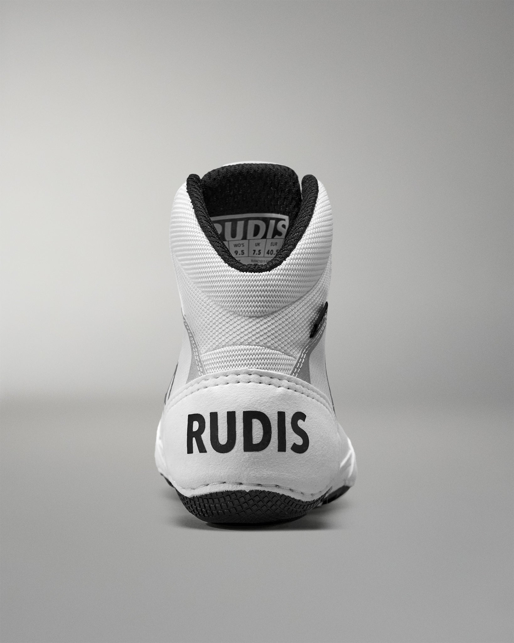 White Wrestling shoe with 'RUDIS' branding on a gray background