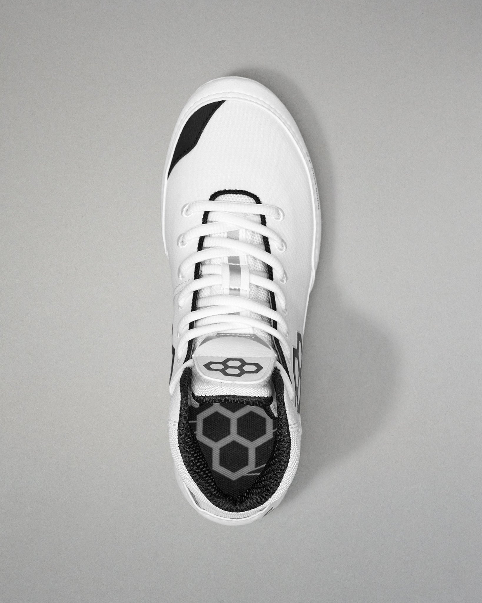 White Wrestling shoe with black sole on a gray background