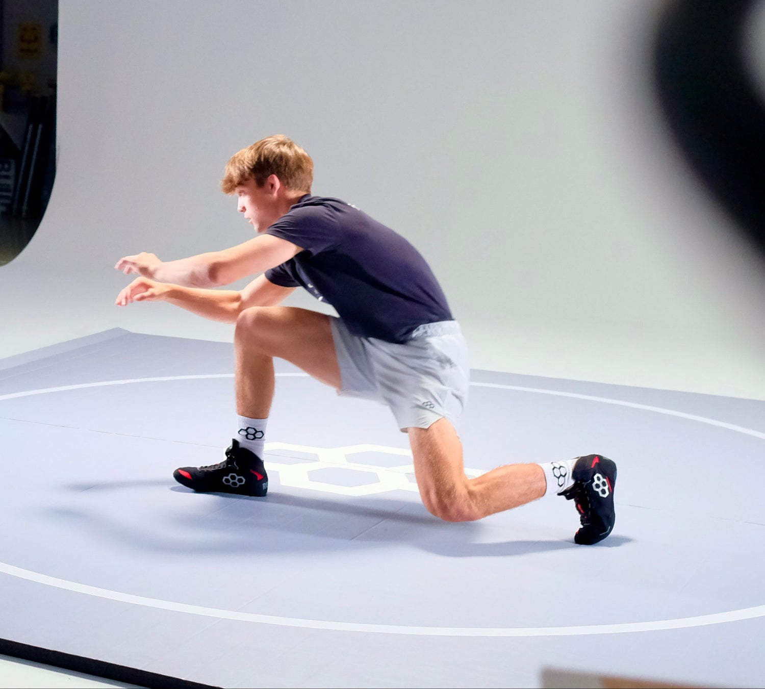 Wrestler, Marcus Blaze, training on mat wearing Colt 4.0 wrestling shoes by RUDIS, lightweight and durable wrestling shoes built for beginners and all levels