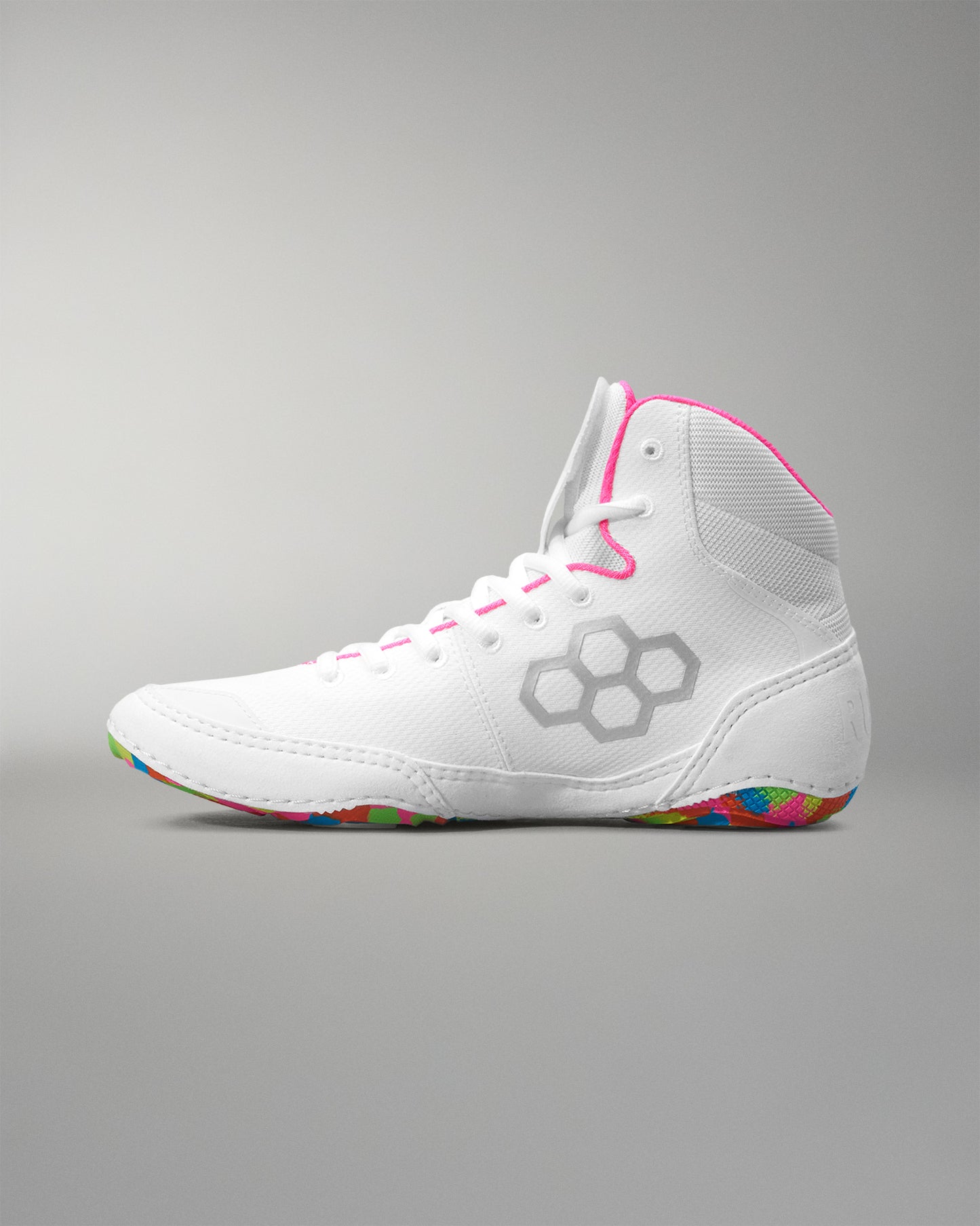 White wrestling shoe with colorful sole on a gray background