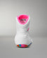 White wrestling shoe with pink interior on a gray background