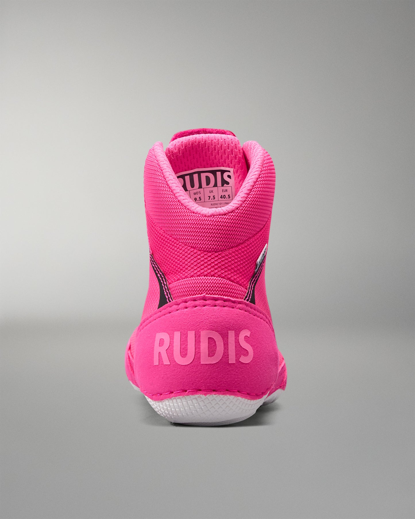 Pink athletic shoe with 'RUDIS' branding on a gray background