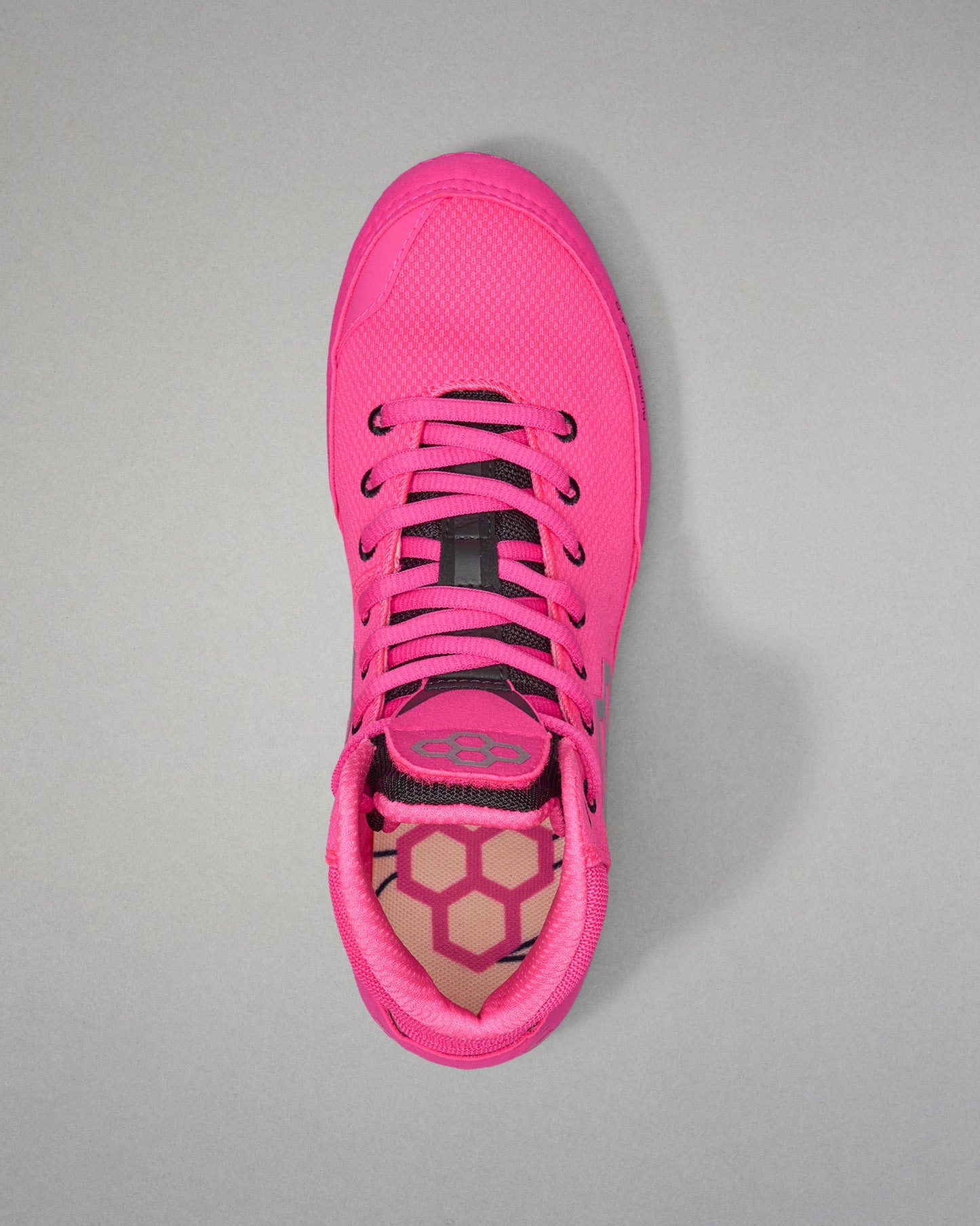 Pink athletic shoe on a gray background