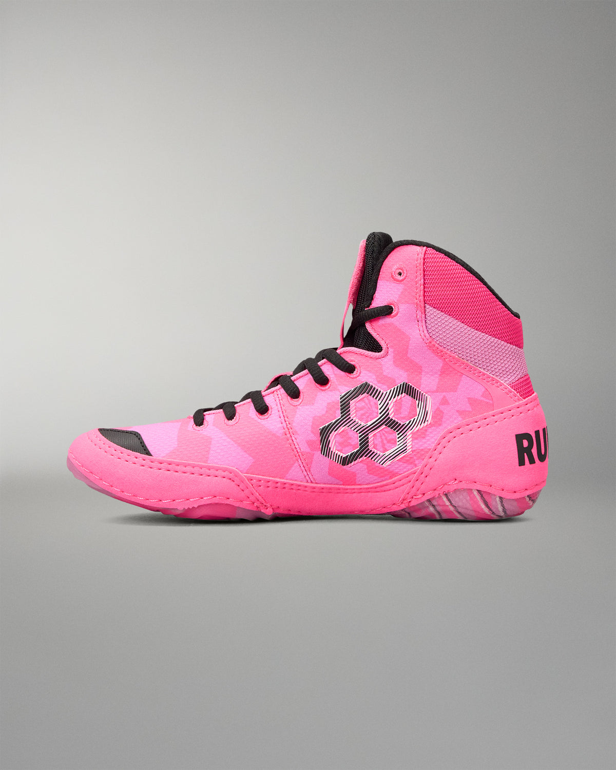 A high-top Wrestling shoe in vibrant pink with a subtle tonal geometric pattern, black laces, and black accents, shown from a side profile on a neutral gray background.
