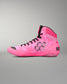 A high-top Wrestling shoe in vibrant pink with a subtle tonal geometric pattern, black laces, and black accents, shown from a side profile on a neutral gray background.