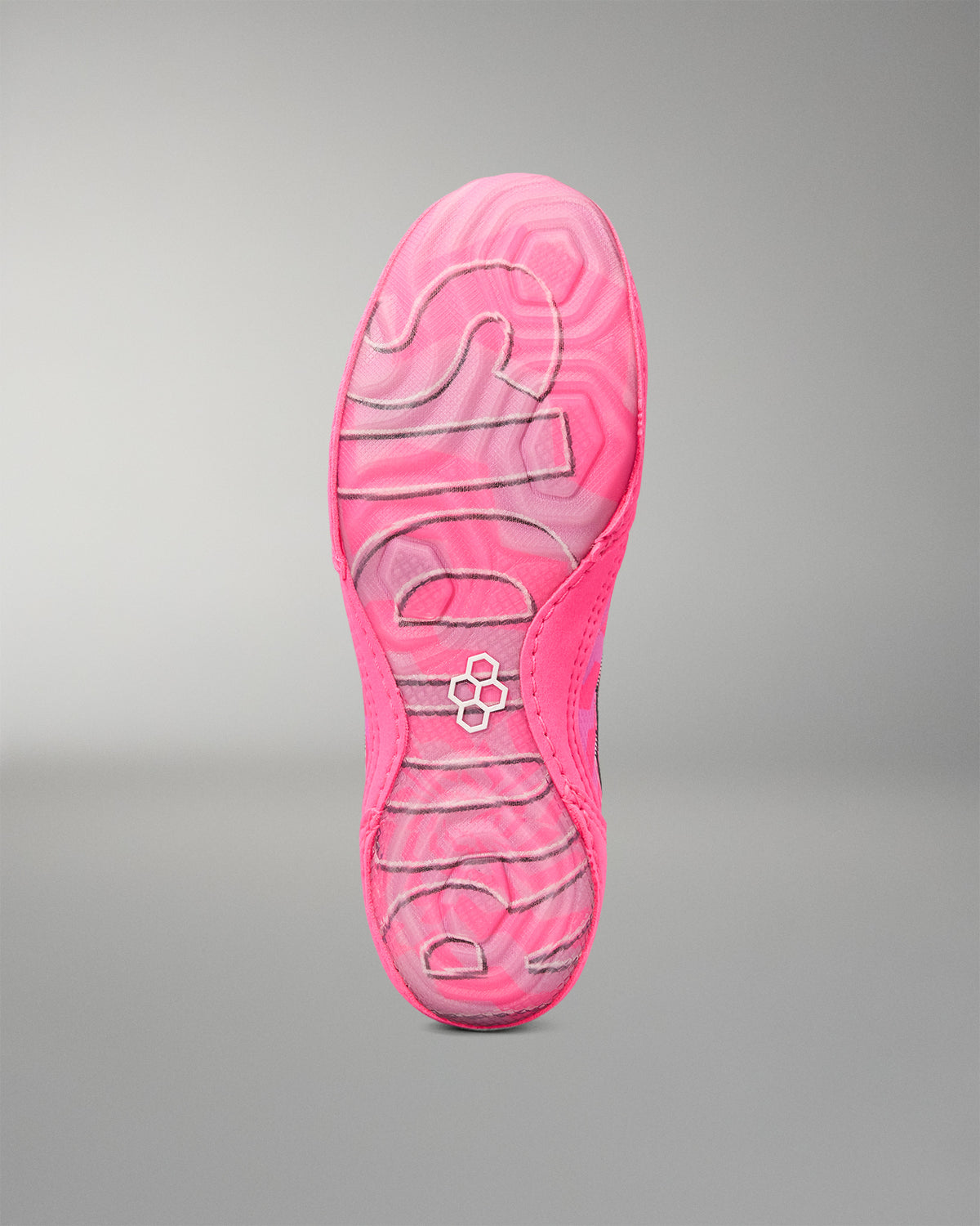 A close-up of a Wrestling shoe's sole showing a vibrant pink and magenta wavy pattern with the brand name 'RUDIS' embossed in white along the center, set against a neutral gray background.