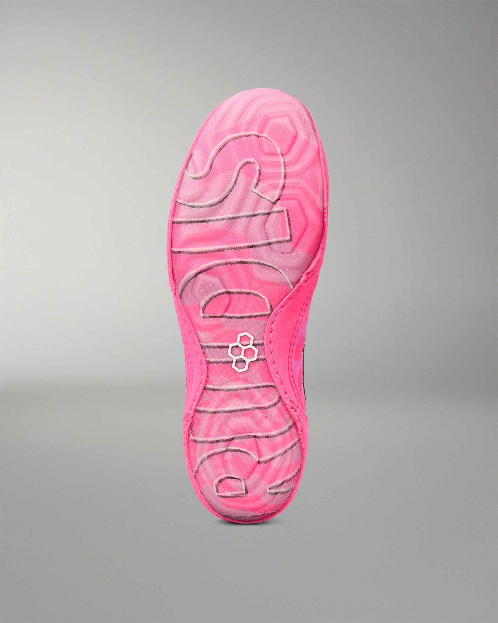 A close-up of a Wrestling shoe's sole showing a vibrant pink and magenta wavy pattern with the brand name 'RUDIS' embossed in white along the center, set against a neutral gray background.