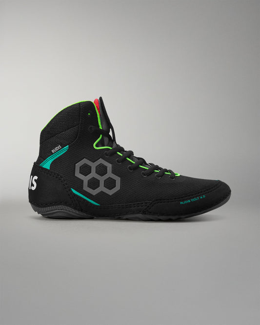 Black wrestling shoe with green accents on a gray background