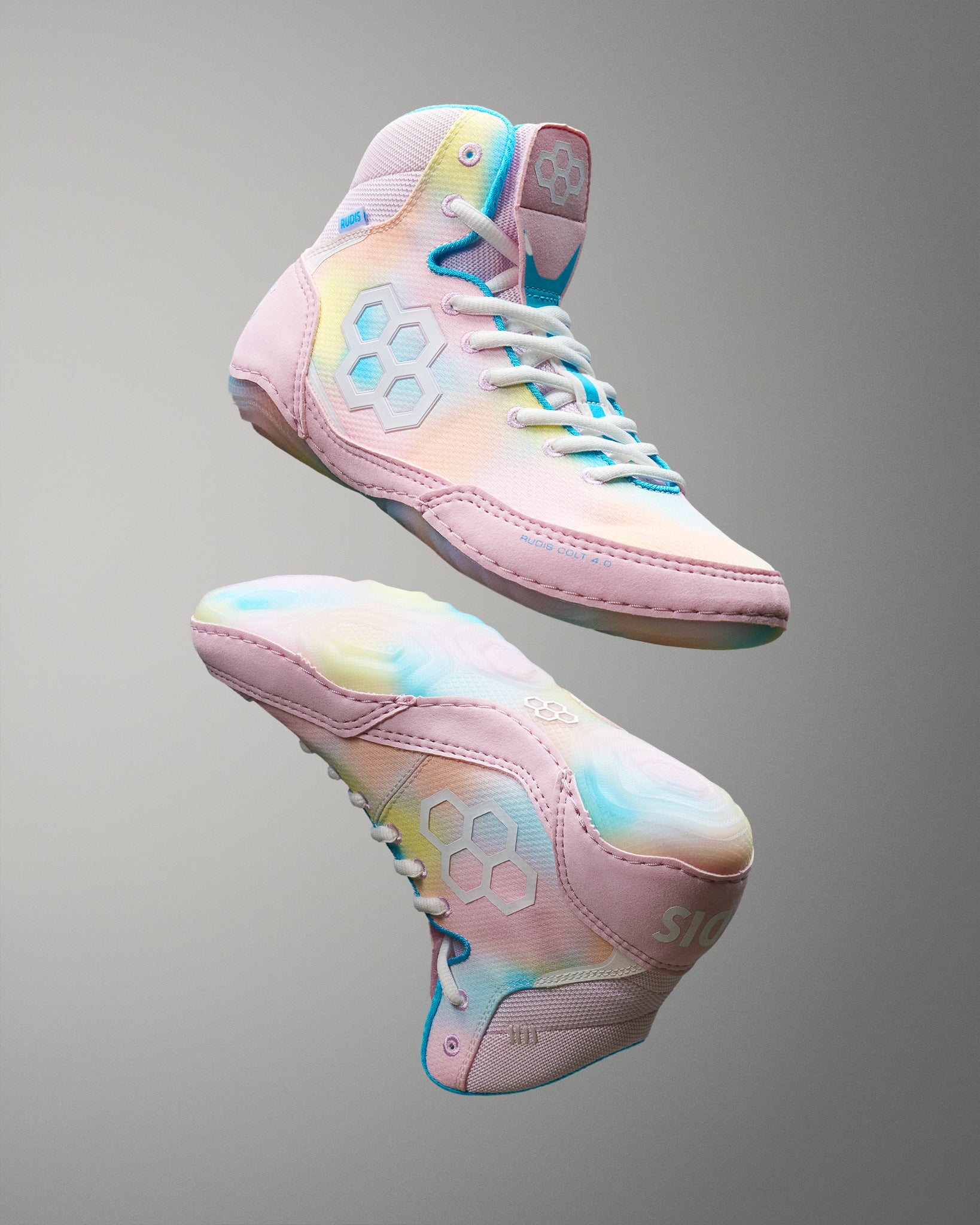 Pastel-colored Wrestling shoes on a gray background