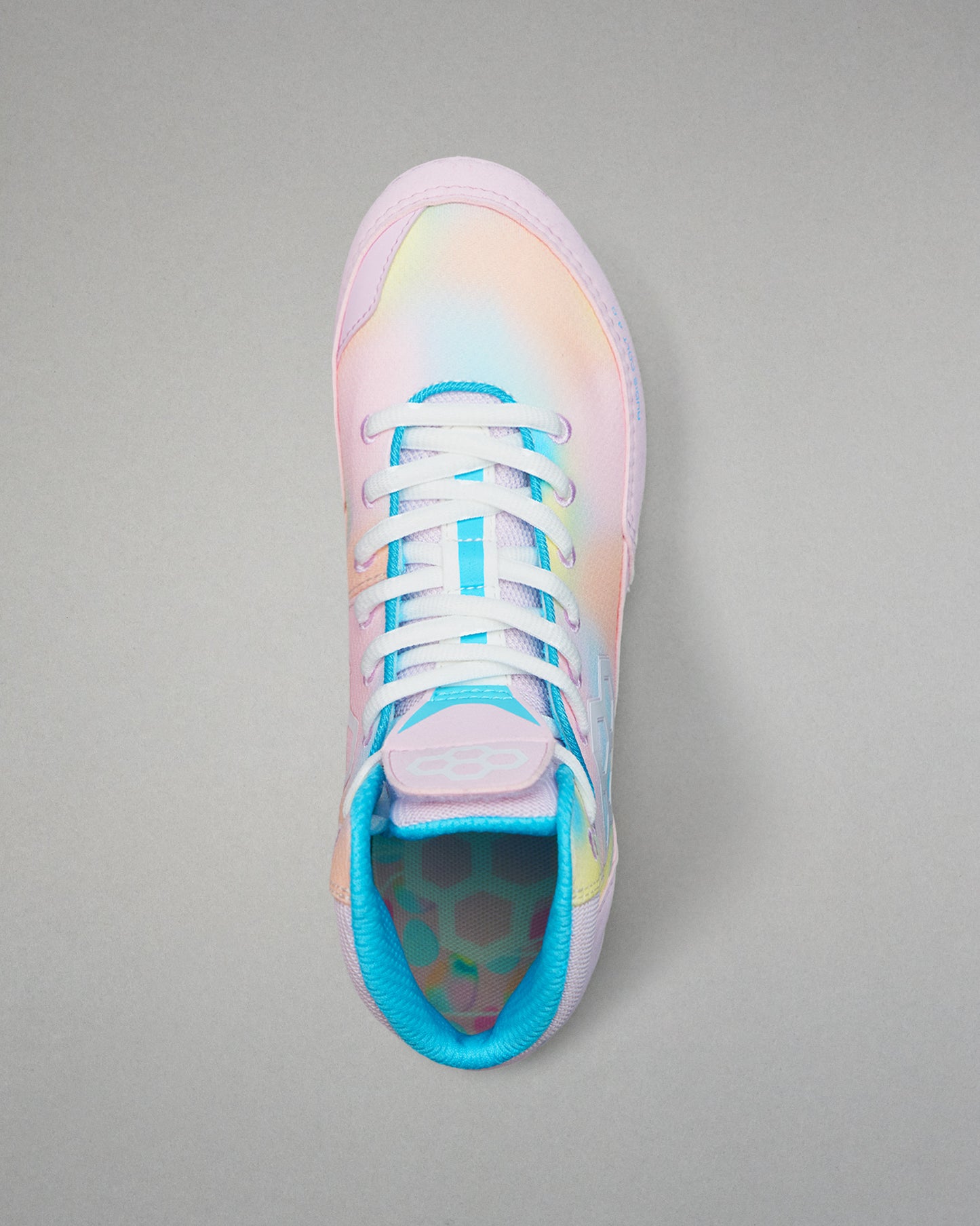 Pastel-colored Wrestling shoe with a gradient design on a gray background