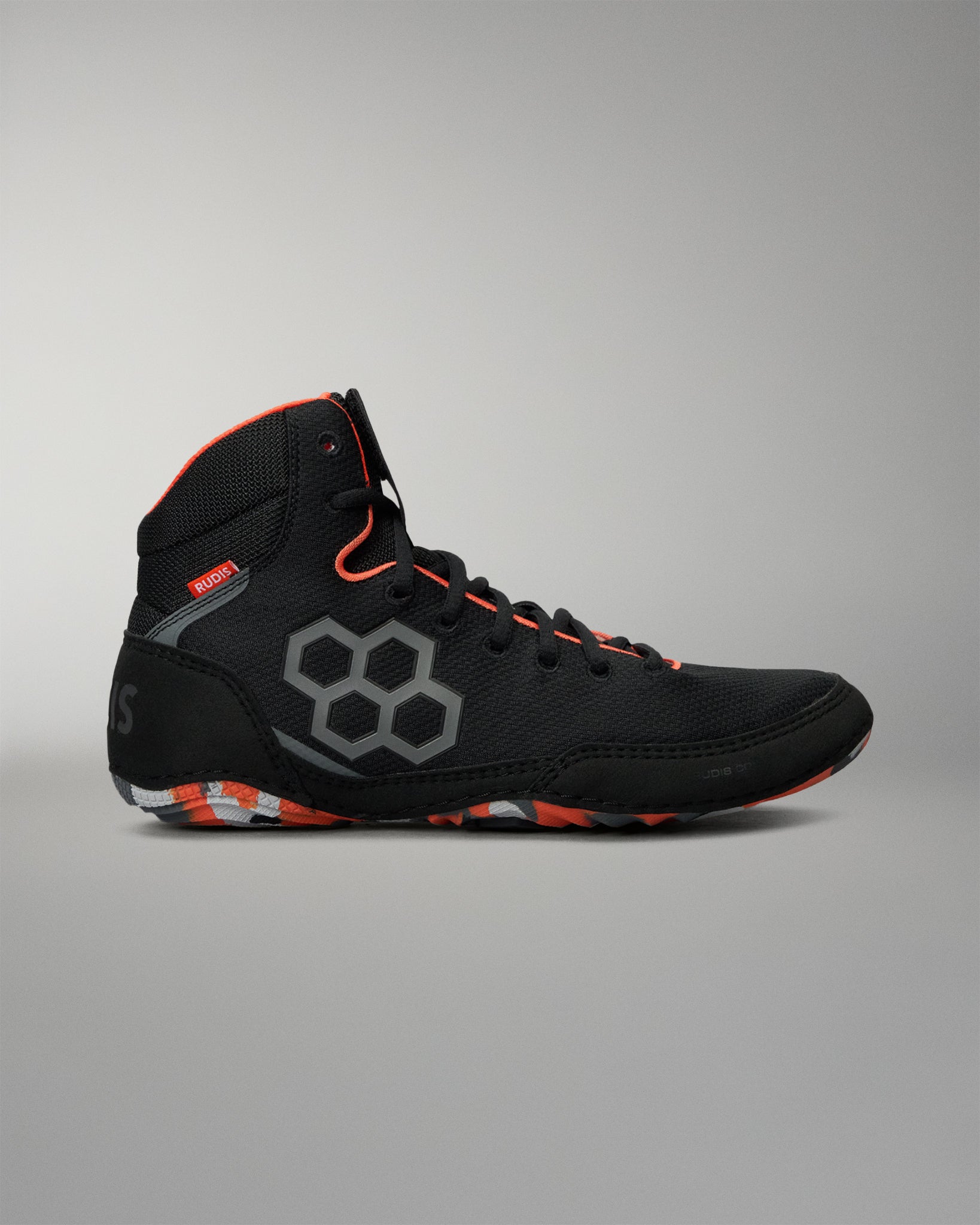 A black high-top Wrestling shoe with gray hexagonal side graphics, bright green laces and trim, and teal accents, shown in profile against a neutral gray background.