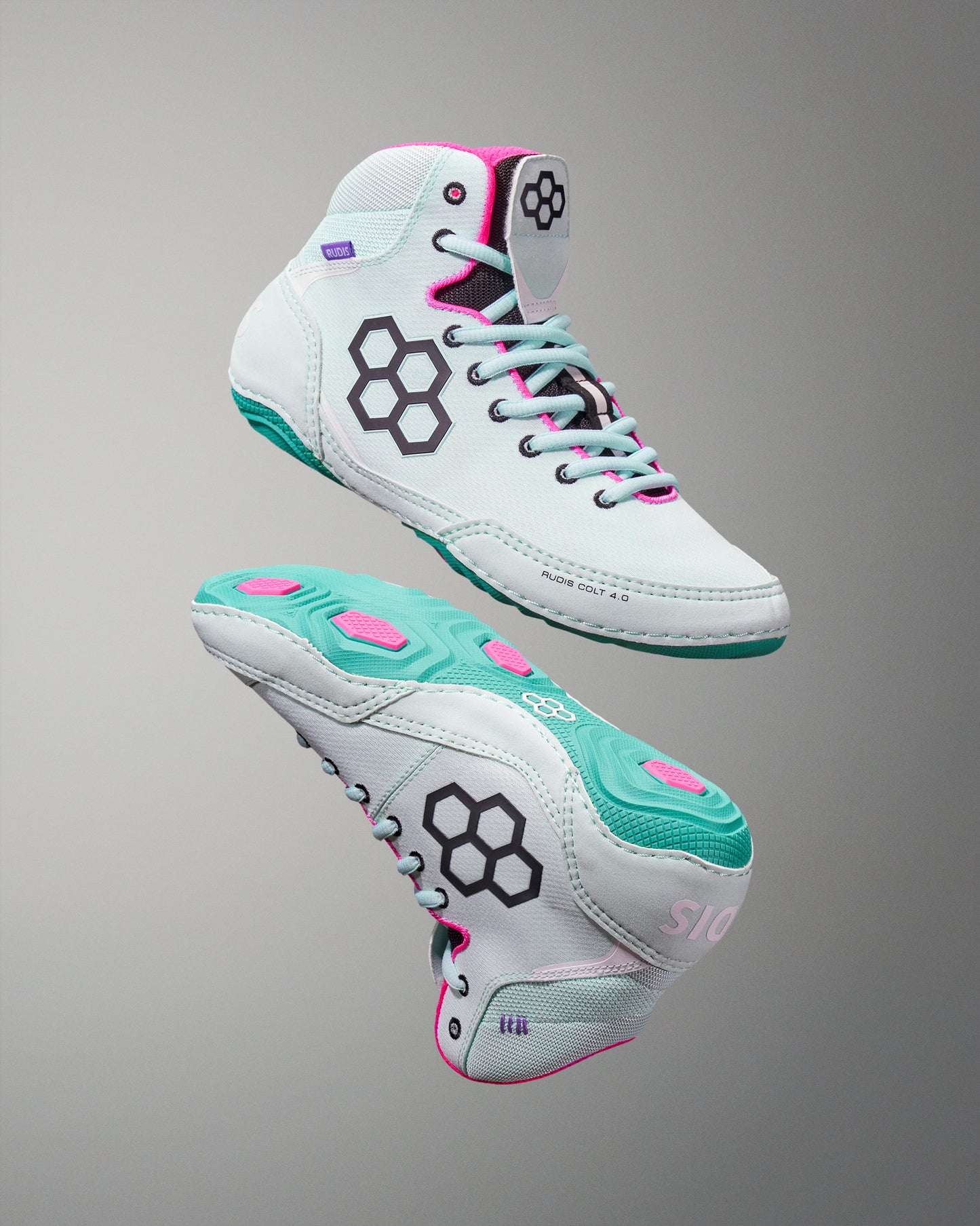 White high-top sneakers with teal soles and pink accents on a gray background