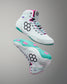 White high-top sneakers with teal soles and pink accents on a gray background