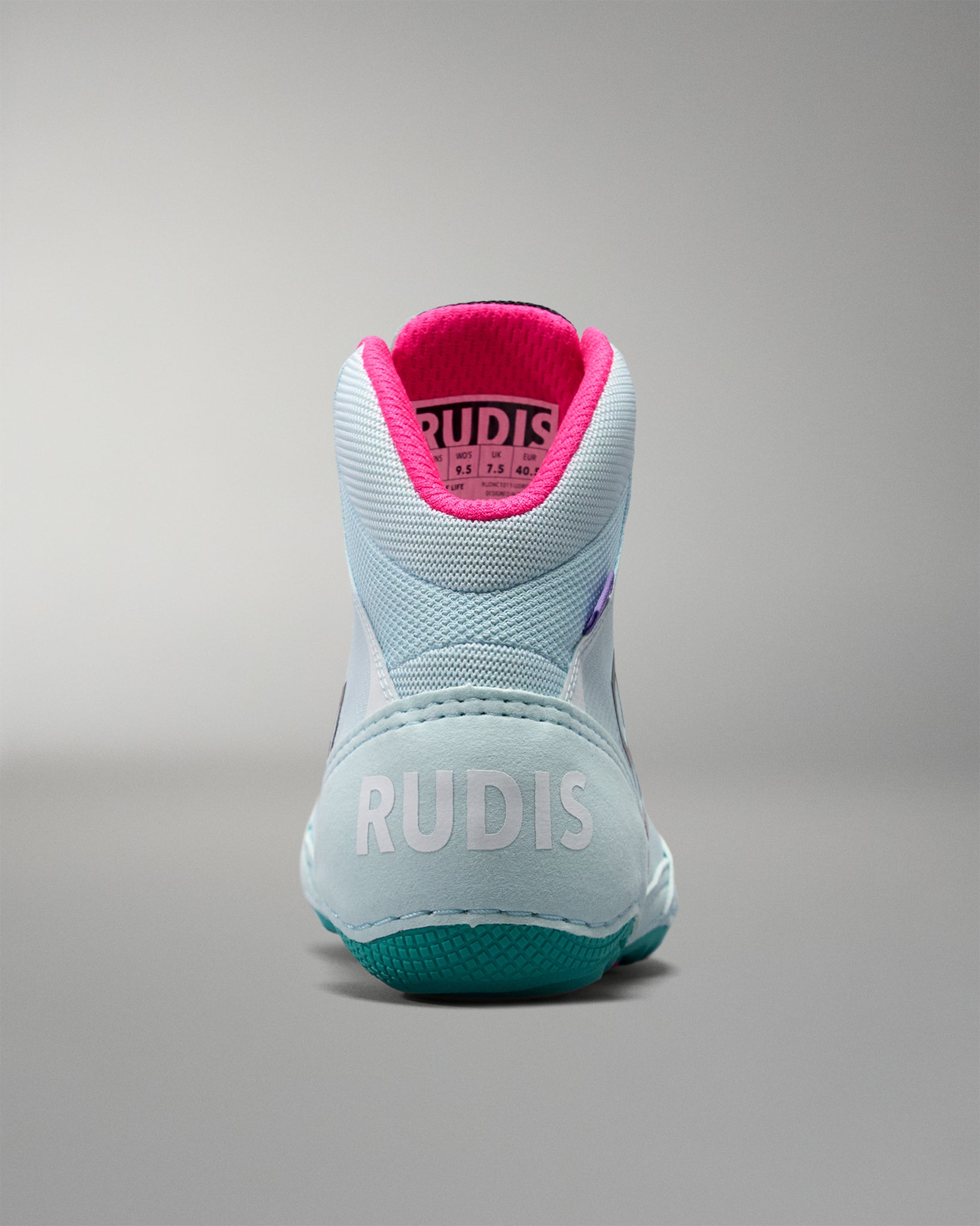Light blue athletic shoe with pink lining on a gray background