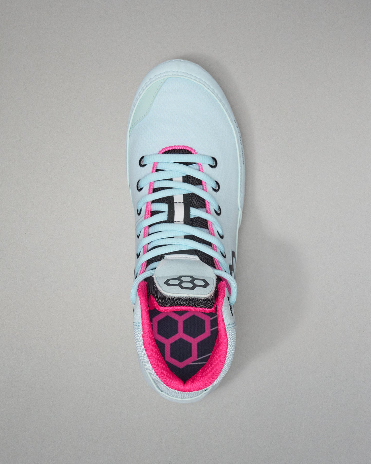 Light blue sneaker with pink accents on a gray background