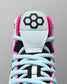 Close-up of a sneaker with a distinctive logo on a gray background