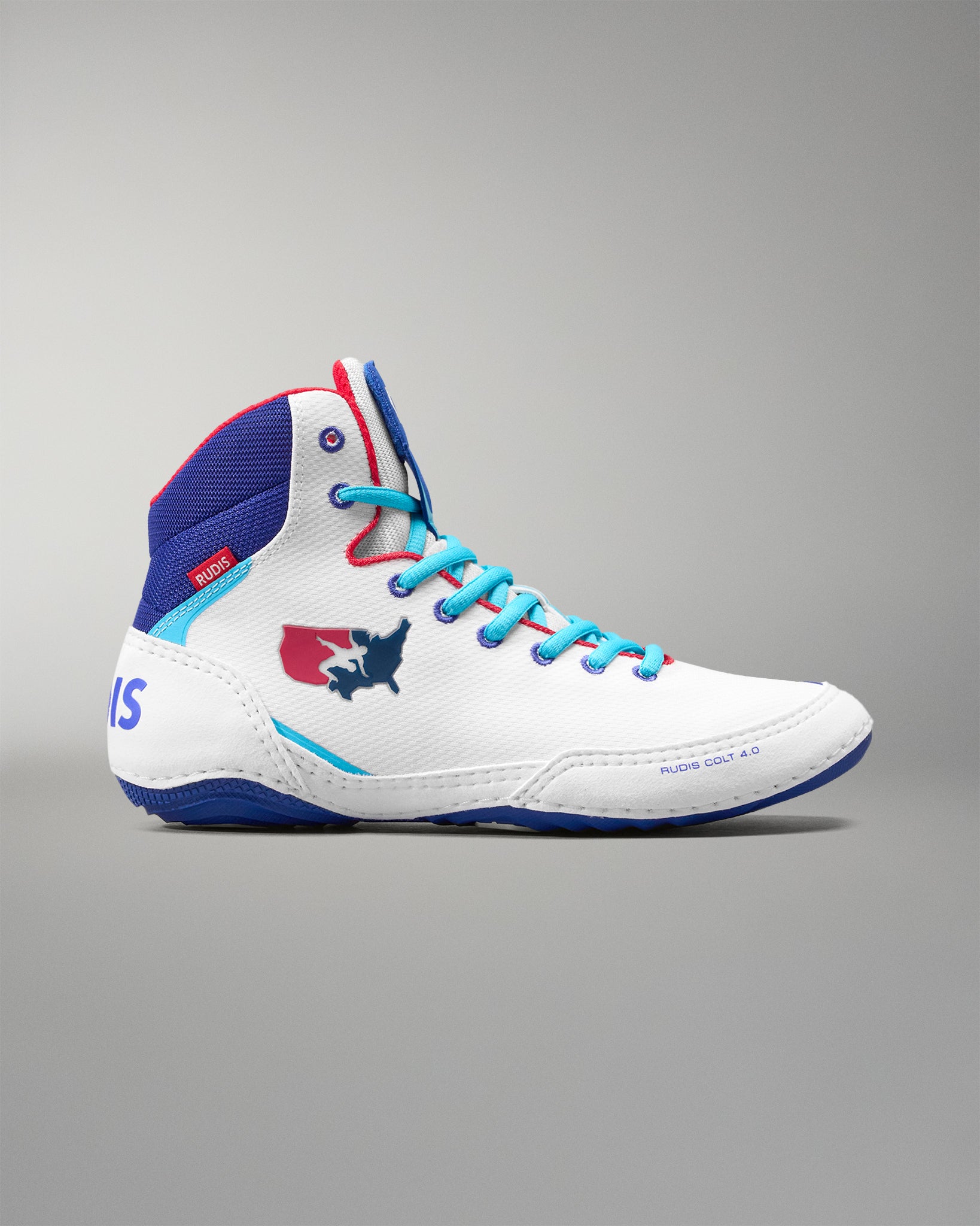 White USA Wrestling Shoes with blue and red accents on a gray background