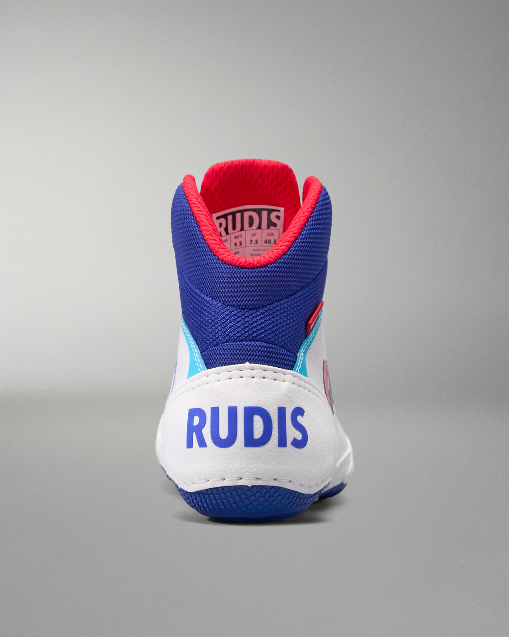 Blue and white USA Wrestling Shoes  with red accents on a gray background