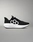 Black and white athletic shoe with a geometric design on a gray background
