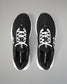Black running shoes with white laces on a gray background