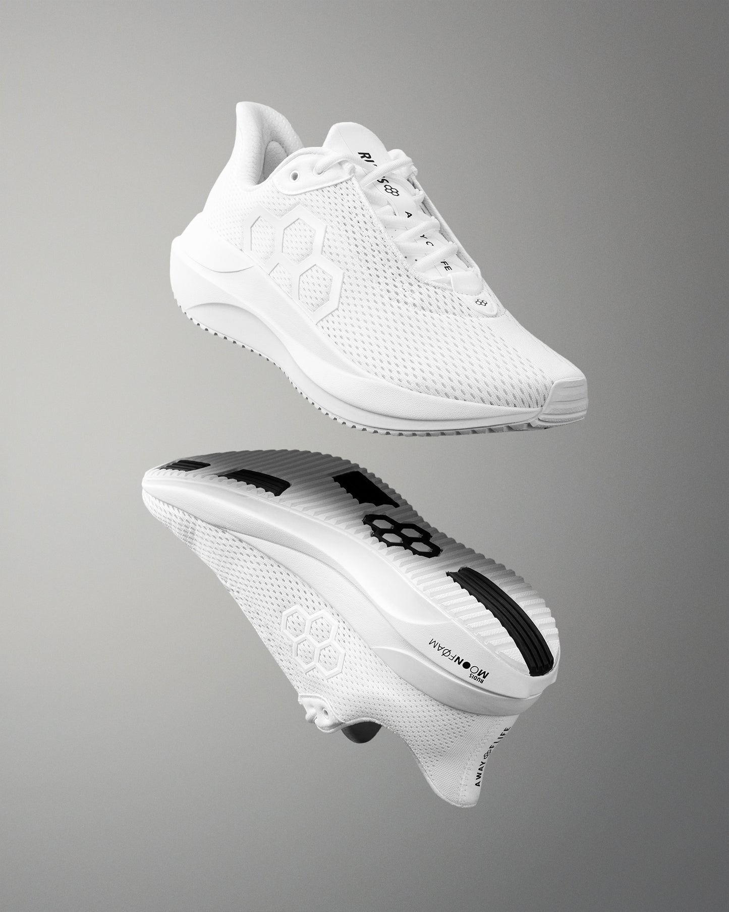 White athletic shoe with brand logo on a gray background