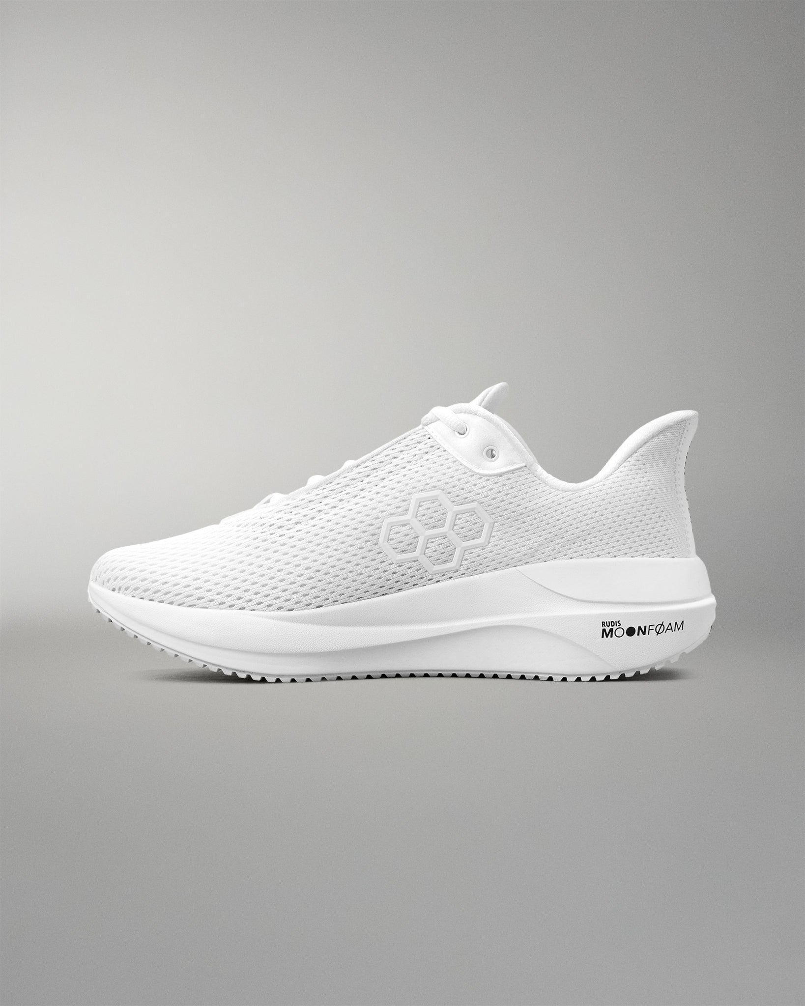 White running shoe on a gray background