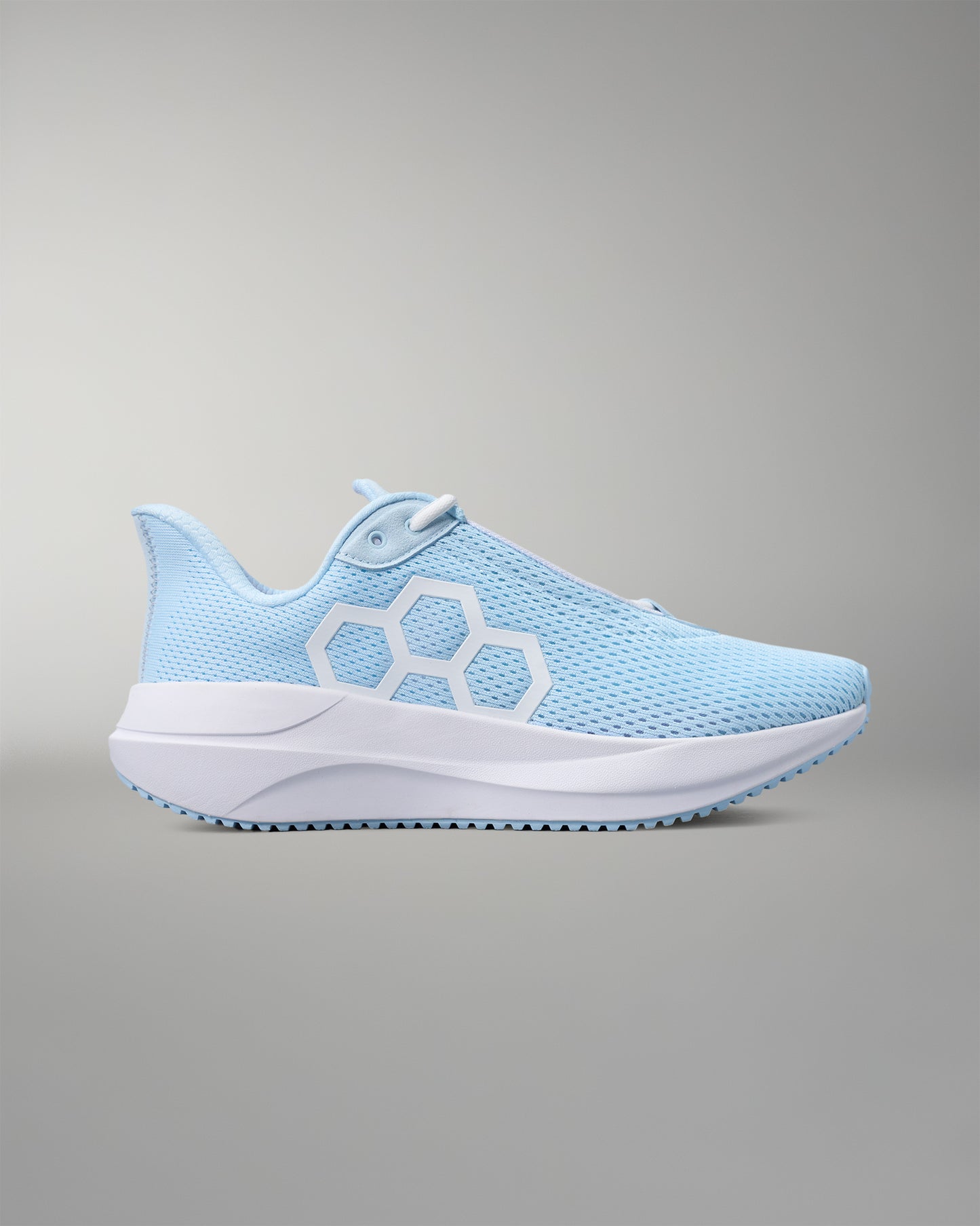 Light blue running shoe with white sole on a gray background