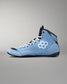 A light blue high-top wrestling shoe with a white geometric hexagon logo on the side, black accents, and white laces, shown against a neutral gray background.