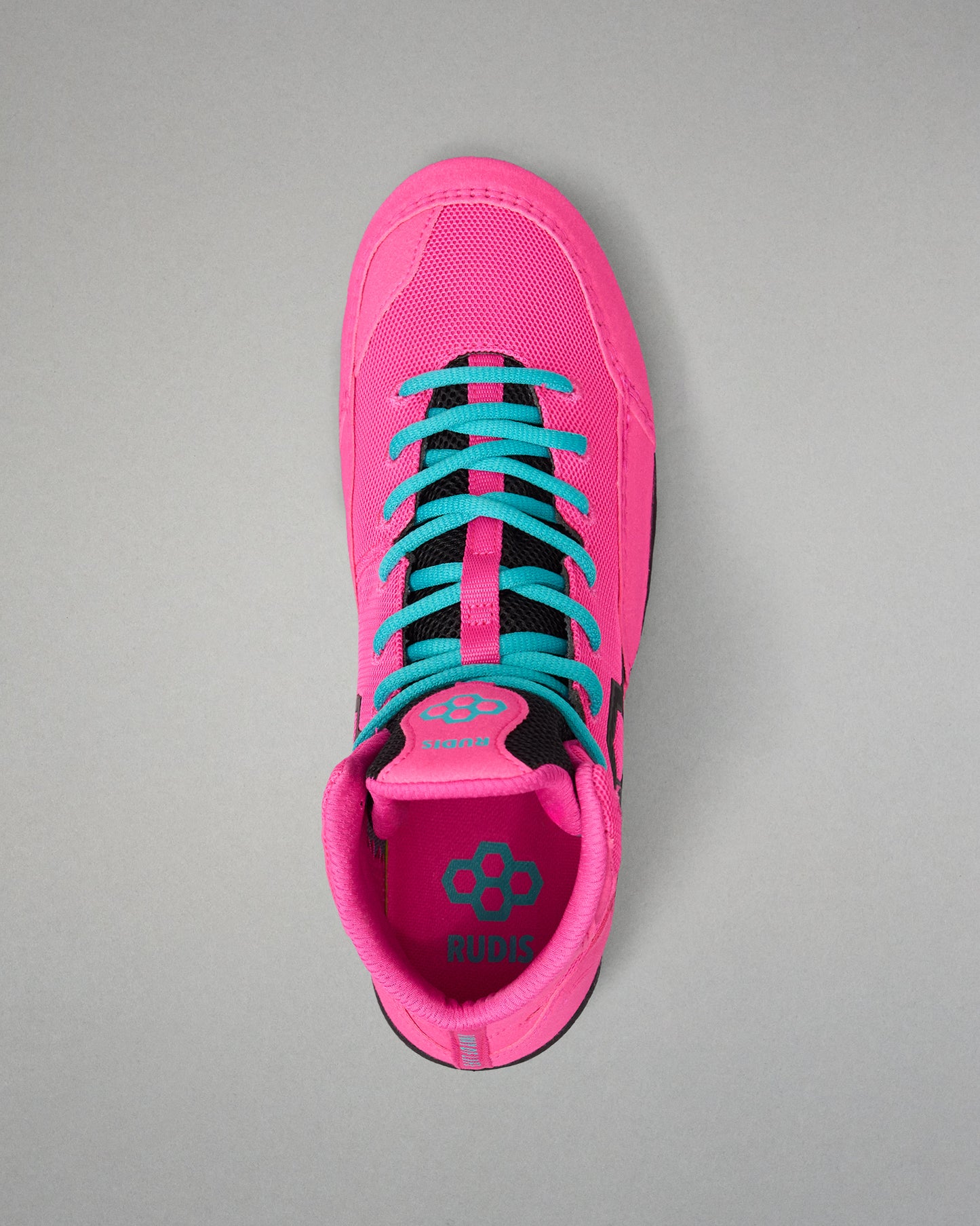 A single bright pink wrestling shoe shown from a top-down view, featuring turquoise laces and a black collar, on a neutral gray background.