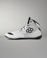 A white high-top wrestling sneaker with black accents, featuring a black geometric logo on the side, white laces, and a black outsole, shown against a neutral gray background.