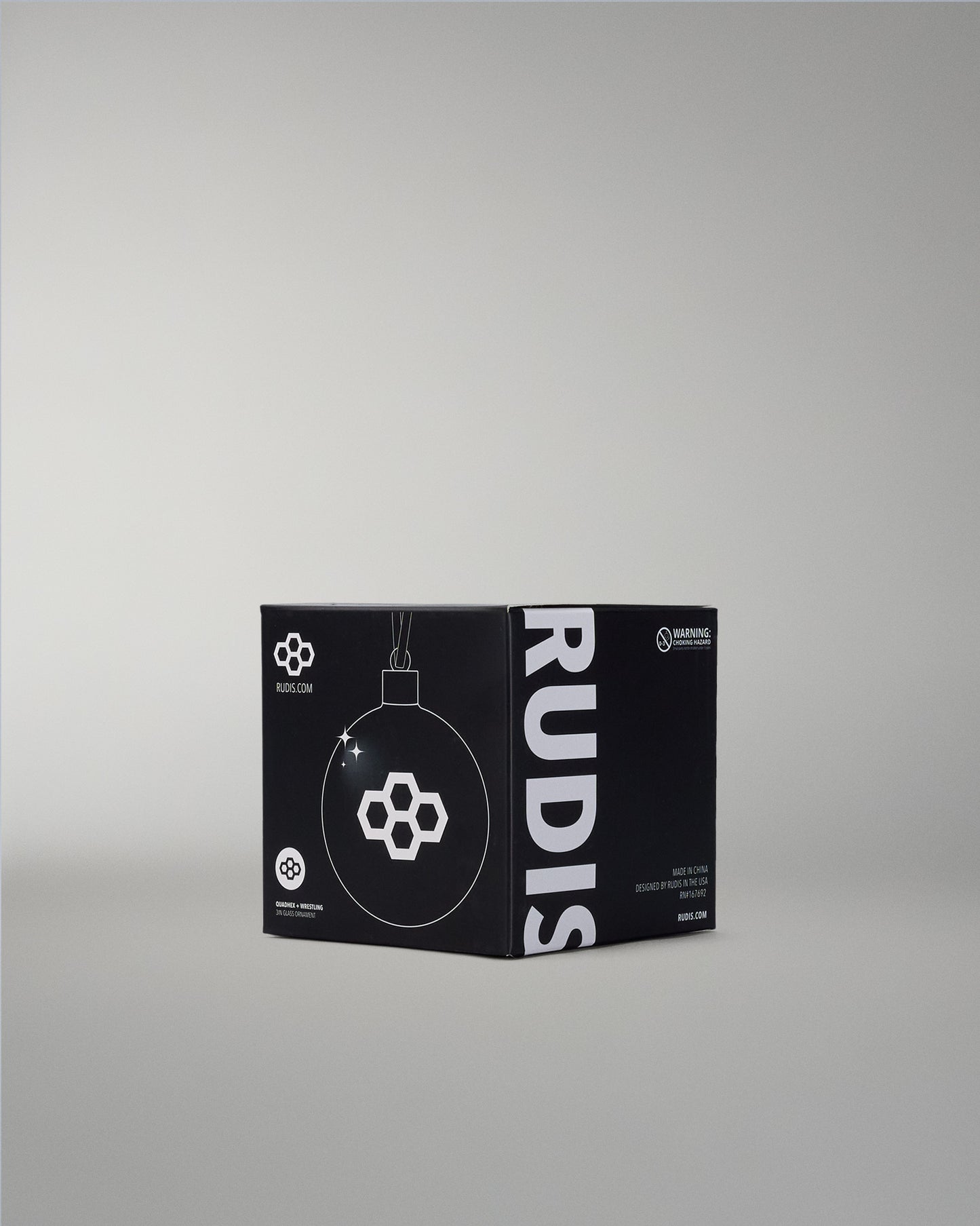 Black box with RUDIS branding on a gray background