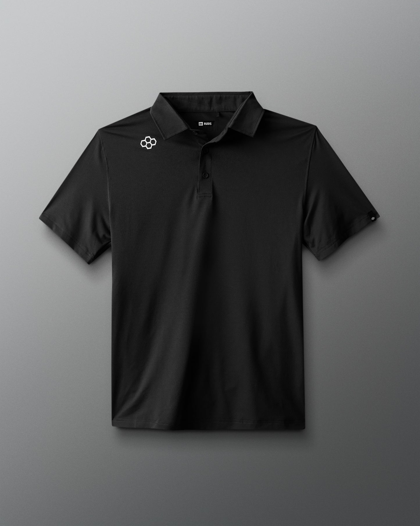 Black polo shirt with a logo on a gray background