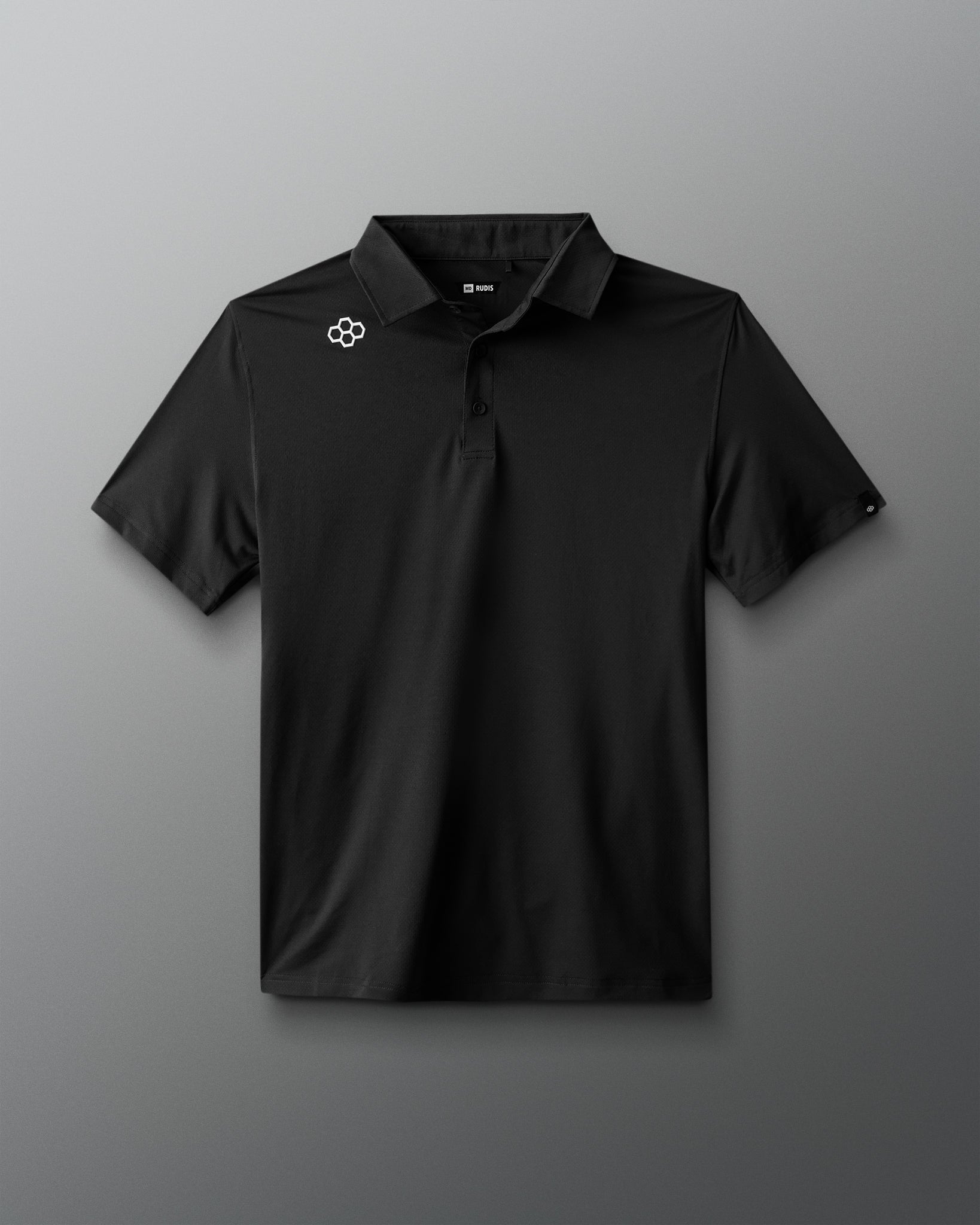 Black polo shirt with a logo on a gray background