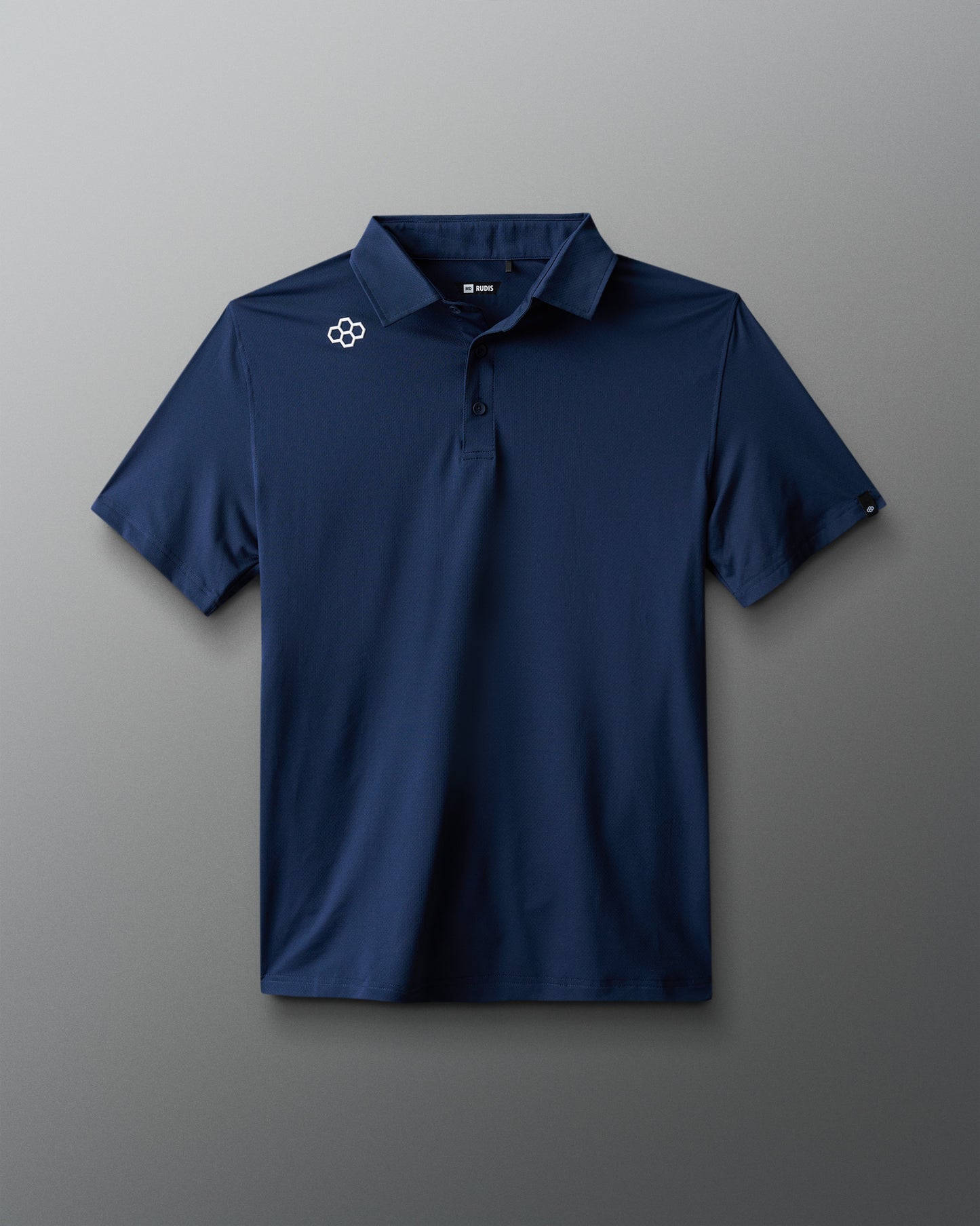 Navy blue polo shirt with a logo on a gray background