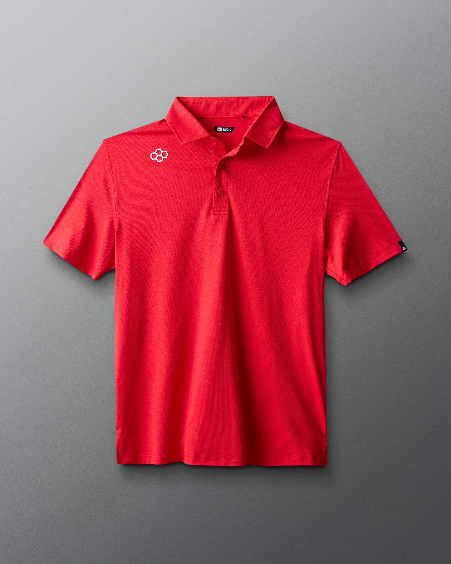 Red polo shirt with a logo on a gray background