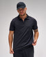 Man wearing a black polo shirt and cap on a gray background