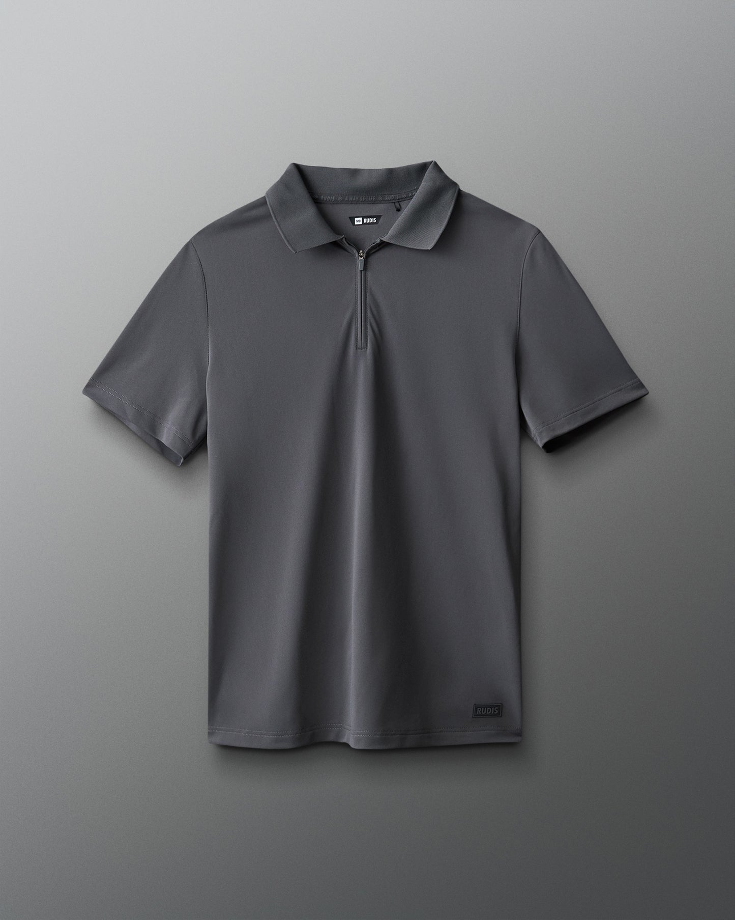 Gray polo shirt with a logo on a gray background