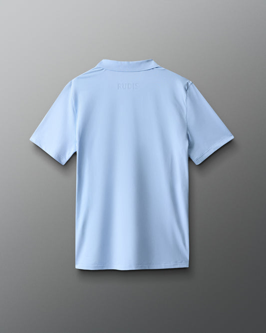 Light blue polo shirt on a gray background