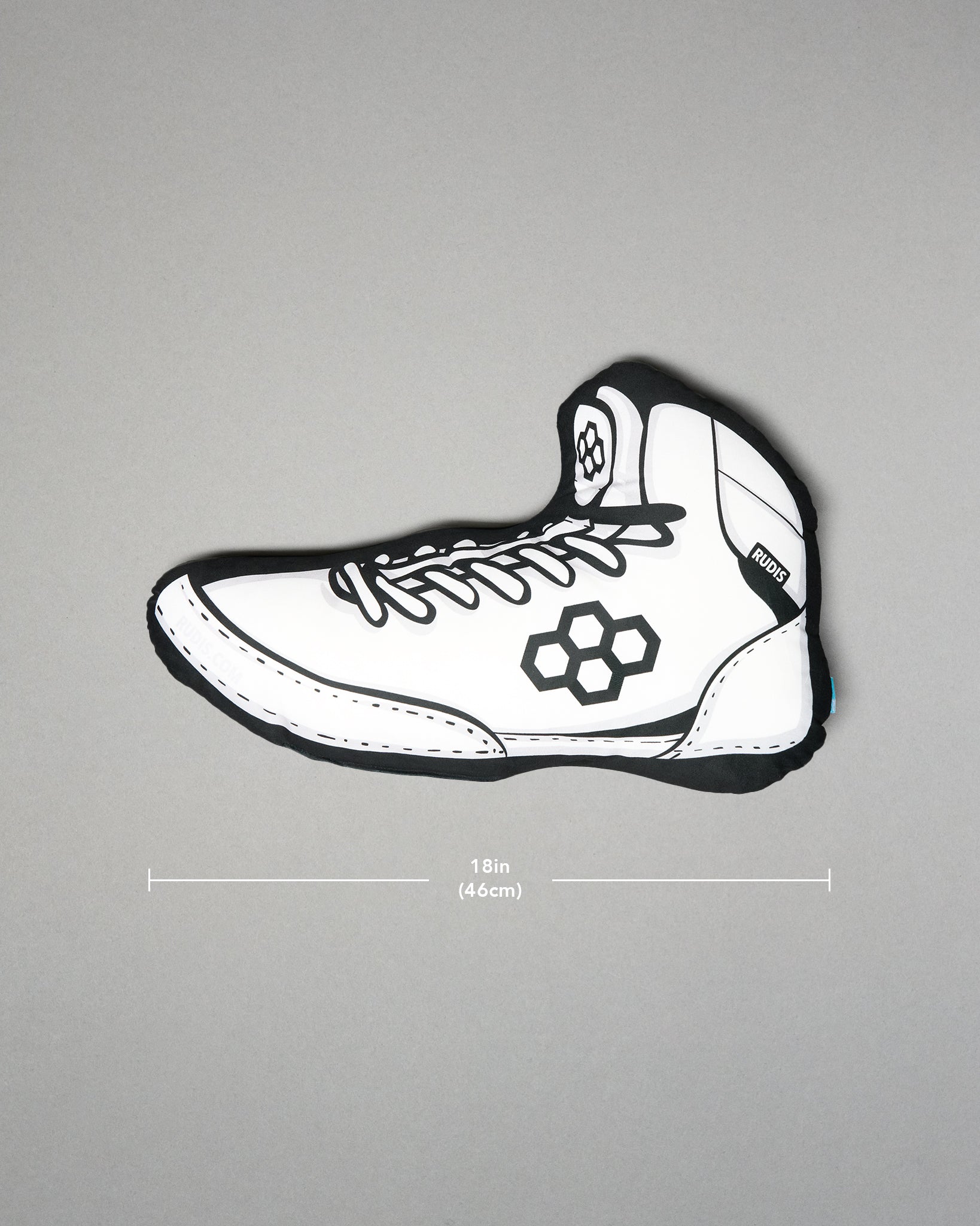 White wrestling shoe pillow with black accents on a gray background