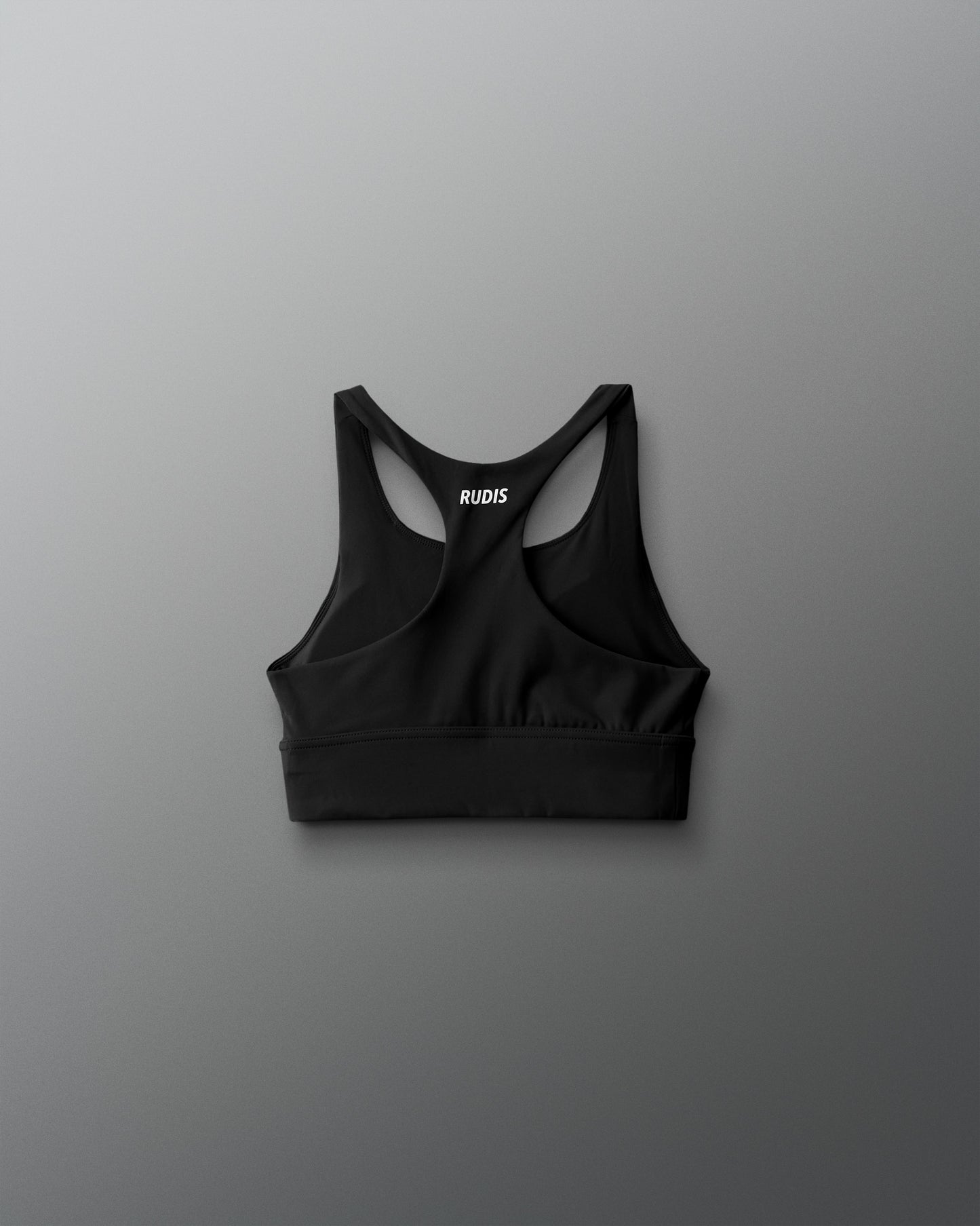 Black sports bra with brand logo on a gray background