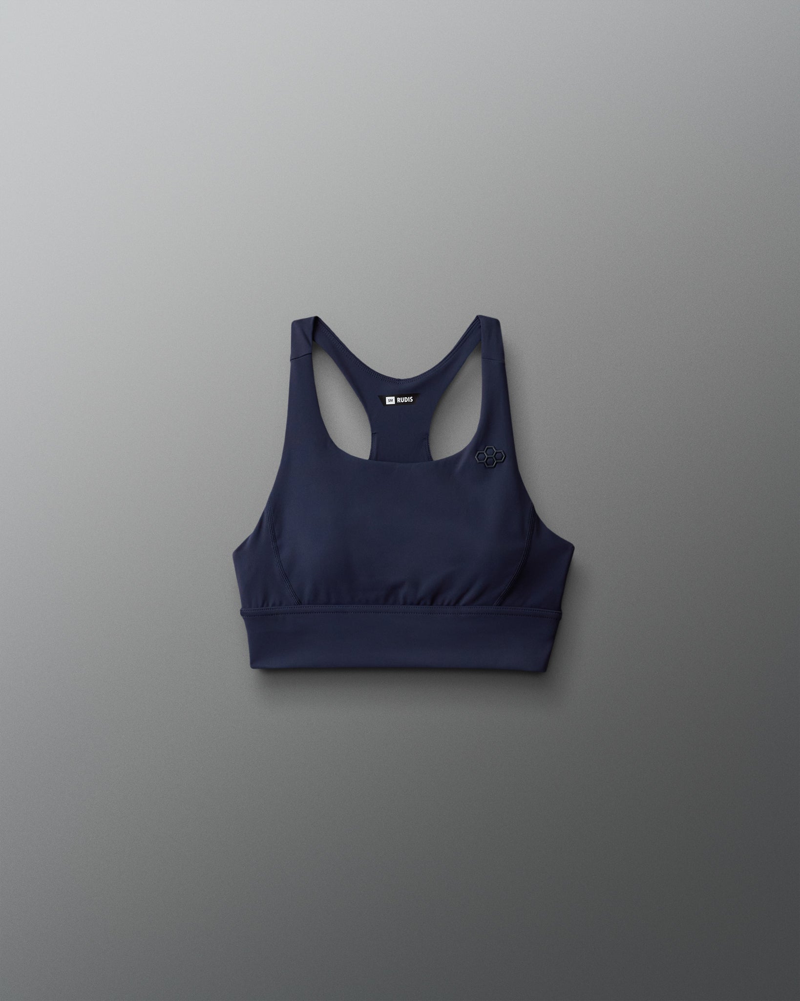 Navy blue sports bra on a gray background