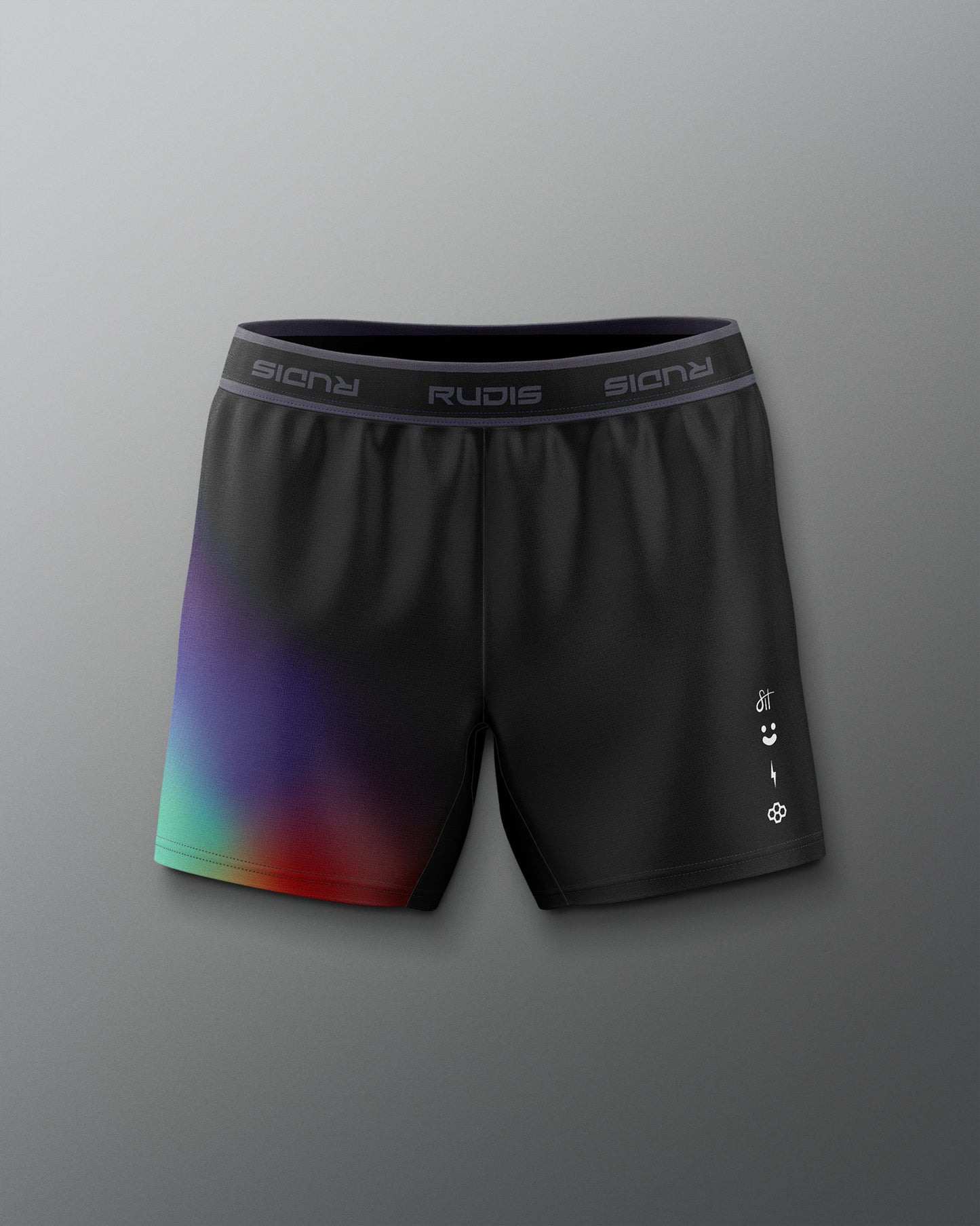 Black athletic shorts with a colorful gradient on a gray background