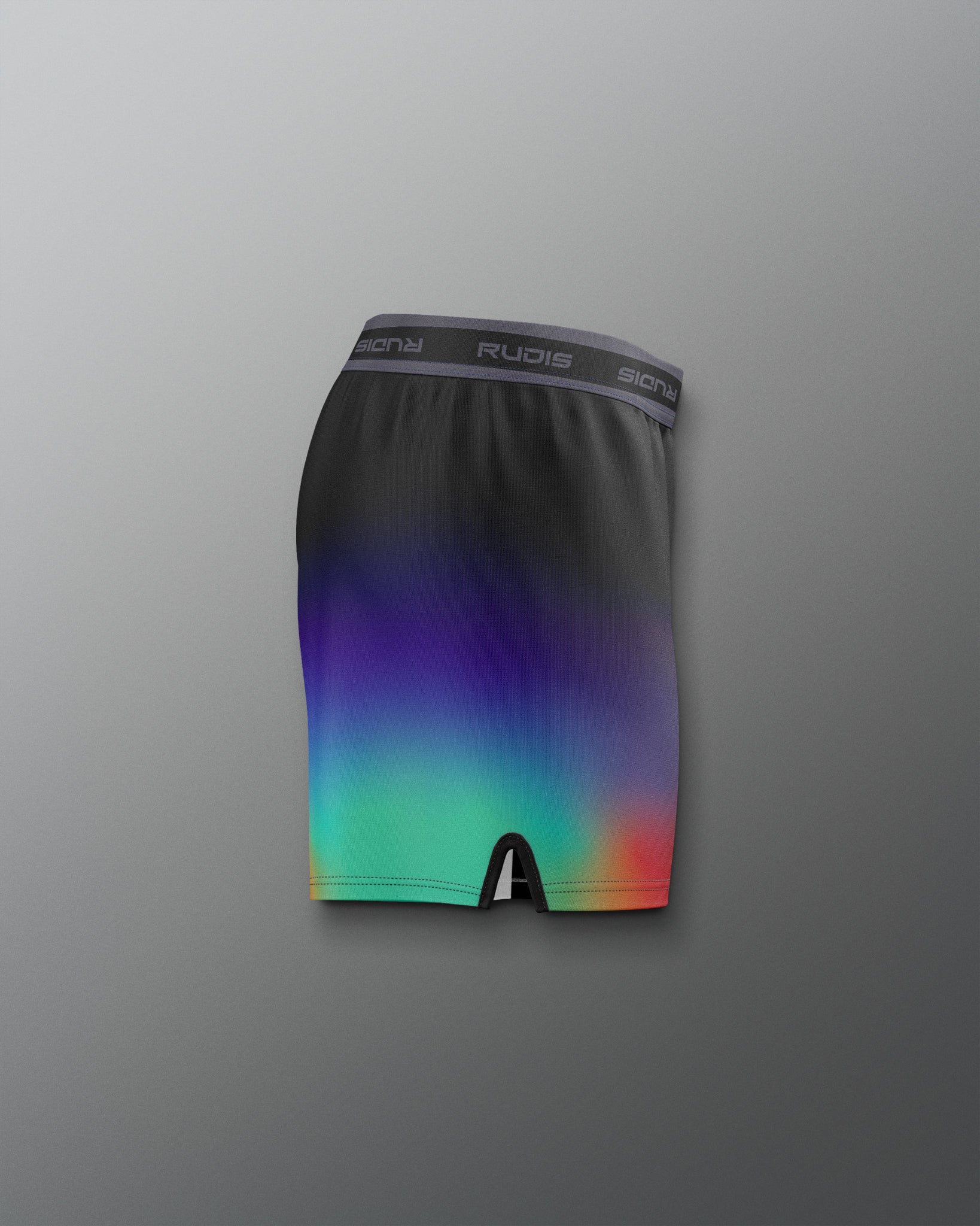 Gradient black to colorful athletic shorts on a gray background