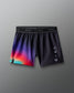 Black athletic shorts with a colorful gradient on a gray background